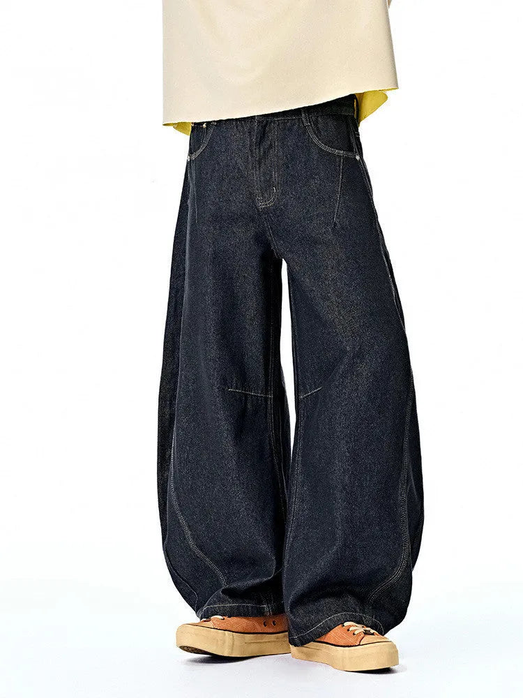Men's wide leg denim trousers in original cow colour showing mid-waist design and relaxed fit