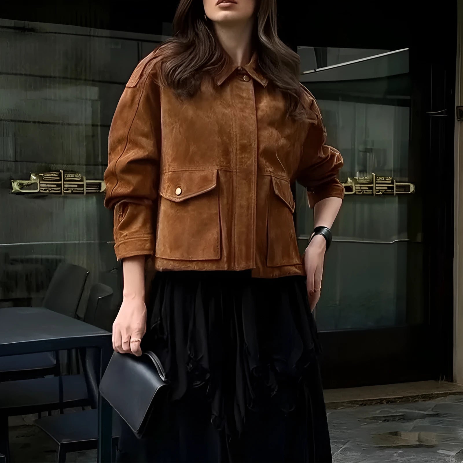 Women's bright brown suede coat with regular sleeves on a hanger