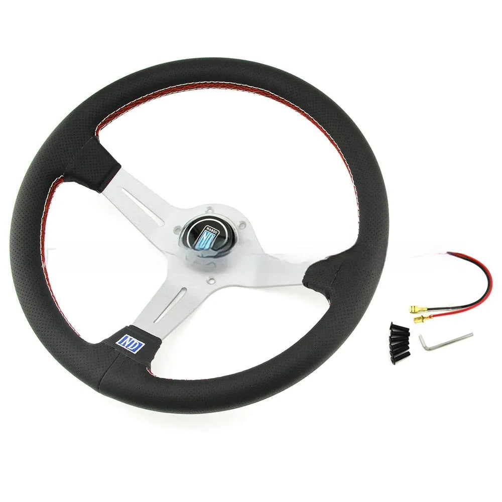 14-inch black leather steering wheel with concave design and silver metal skeleton.