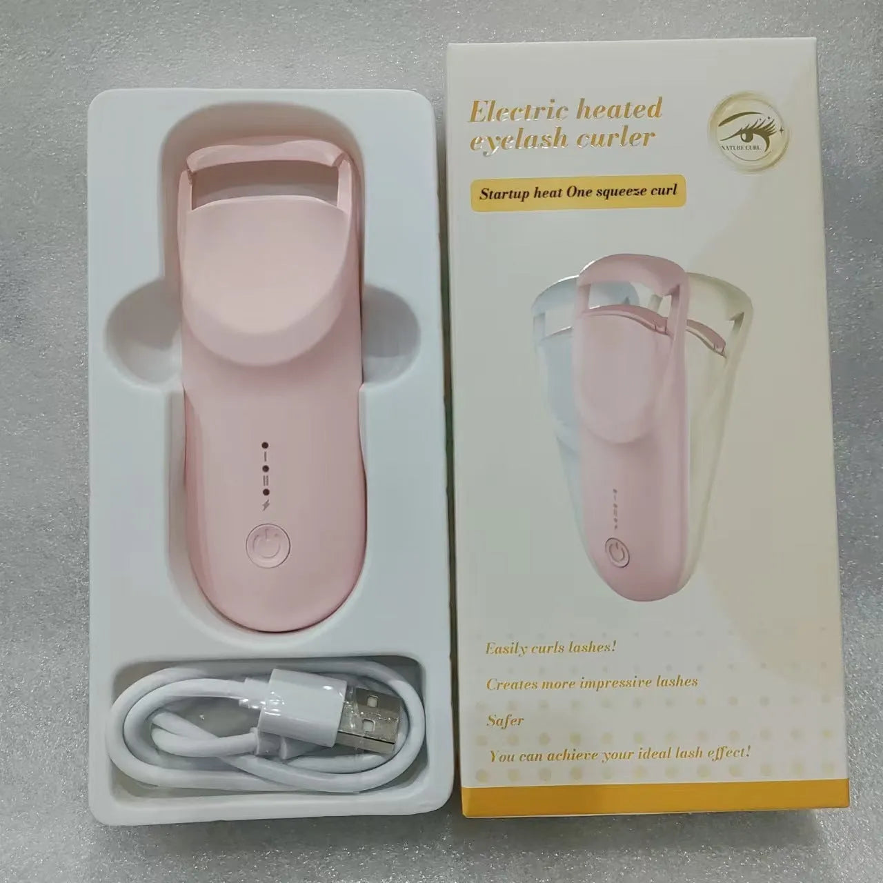 Plastic electric heating eyelash curler with USB cable in cream white, maca pink, or vanilla apricot colour