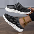 Women's black Flyknit socks semi slipper shoes with striped pattern and hollow-out design on a viscose sole.