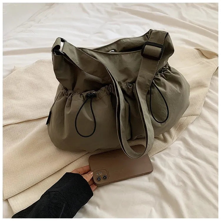 Ultra-light pleated crossbody student bag in polyester with folding design and internal phone pocket
