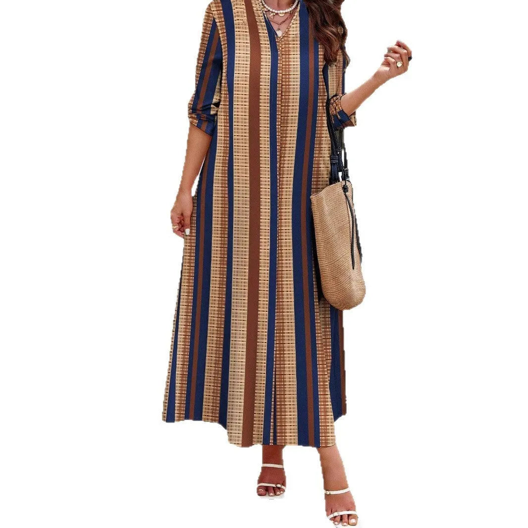 Camel coloured knitted dress with vertical stripes, V-neck and long sleeves in A-line silhouette