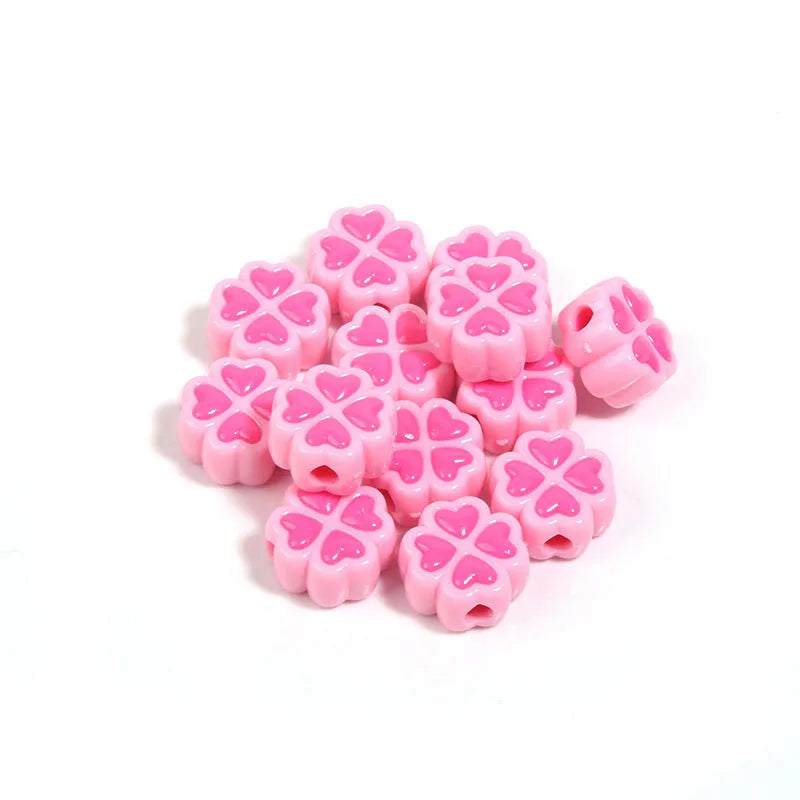 Assorted light-coloured acrylic clover-shaped beads with frosted finish, 15mm size.