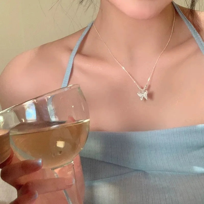 Women's silver butterfly necklace with square line pendant on cross chain