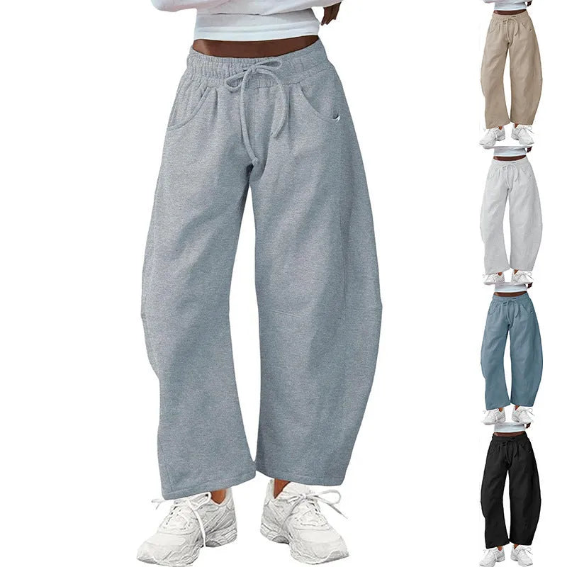 Women's loose cropped sweatpants with drawstring waist and side pockets in apricot colour