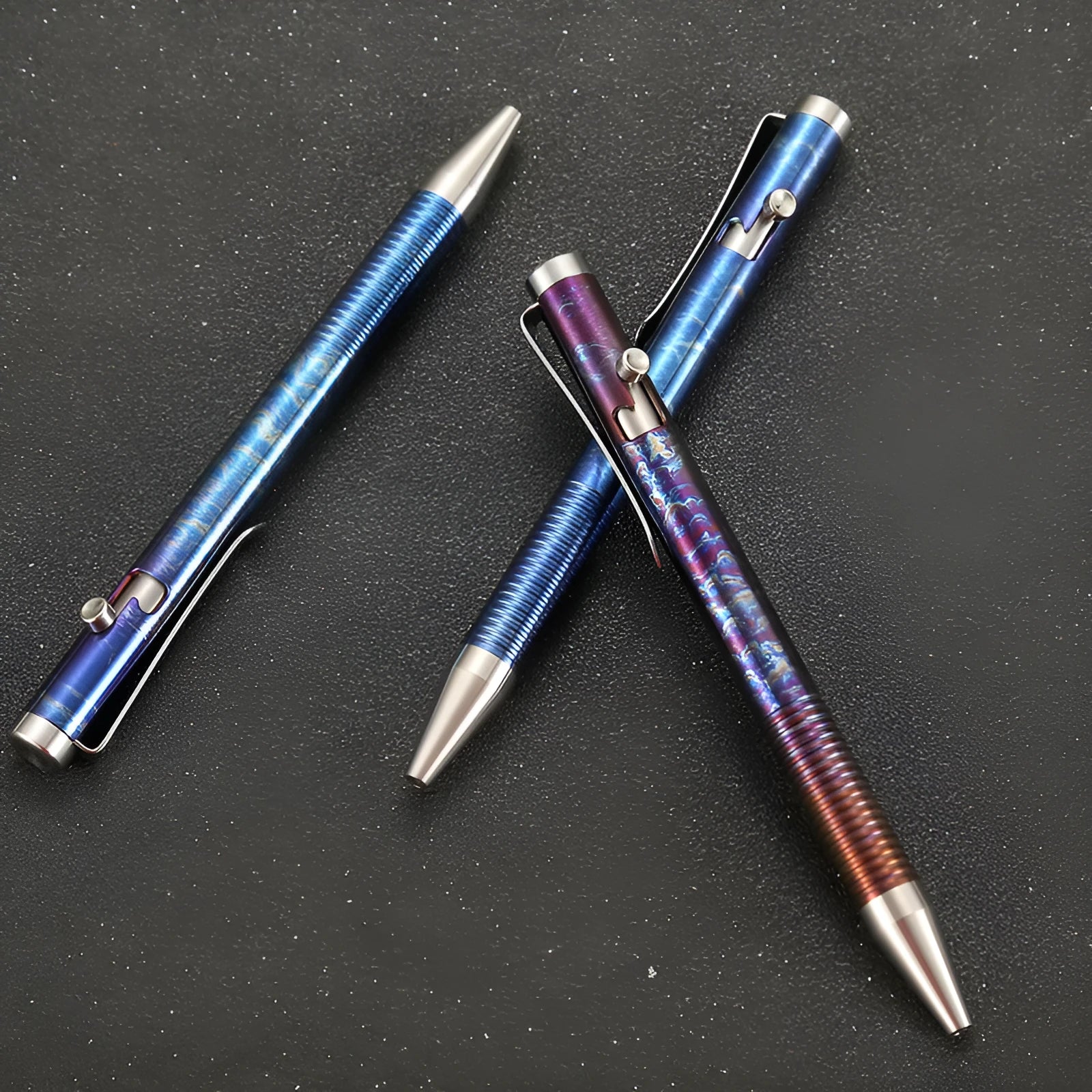 Titanium alloy ball pen with gun bolt handle and iridescent magic colour phantom finish.
