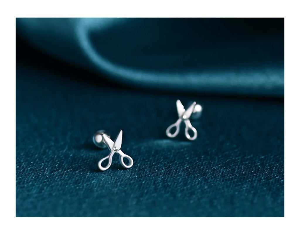 A pair of S999 pure silver screw ear nails with a mini scissors motif.