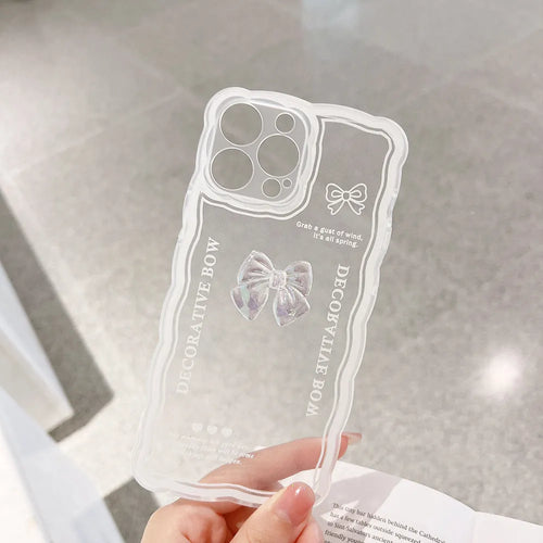 Transparent iPhone case with a three-dimensional ice-through bow decoration on the back.