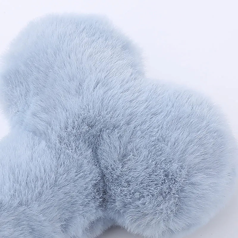 Blue love bone shaped plush dog toy with squeaker for biting and chewing.