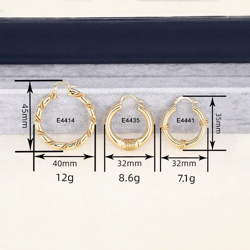 Geometric copper earrings with ring and line design in golden colour