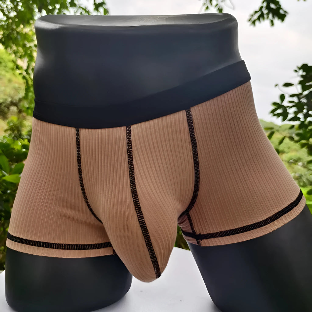 Men's thin fabric boxer shorts in solid colours showing hip lifting design