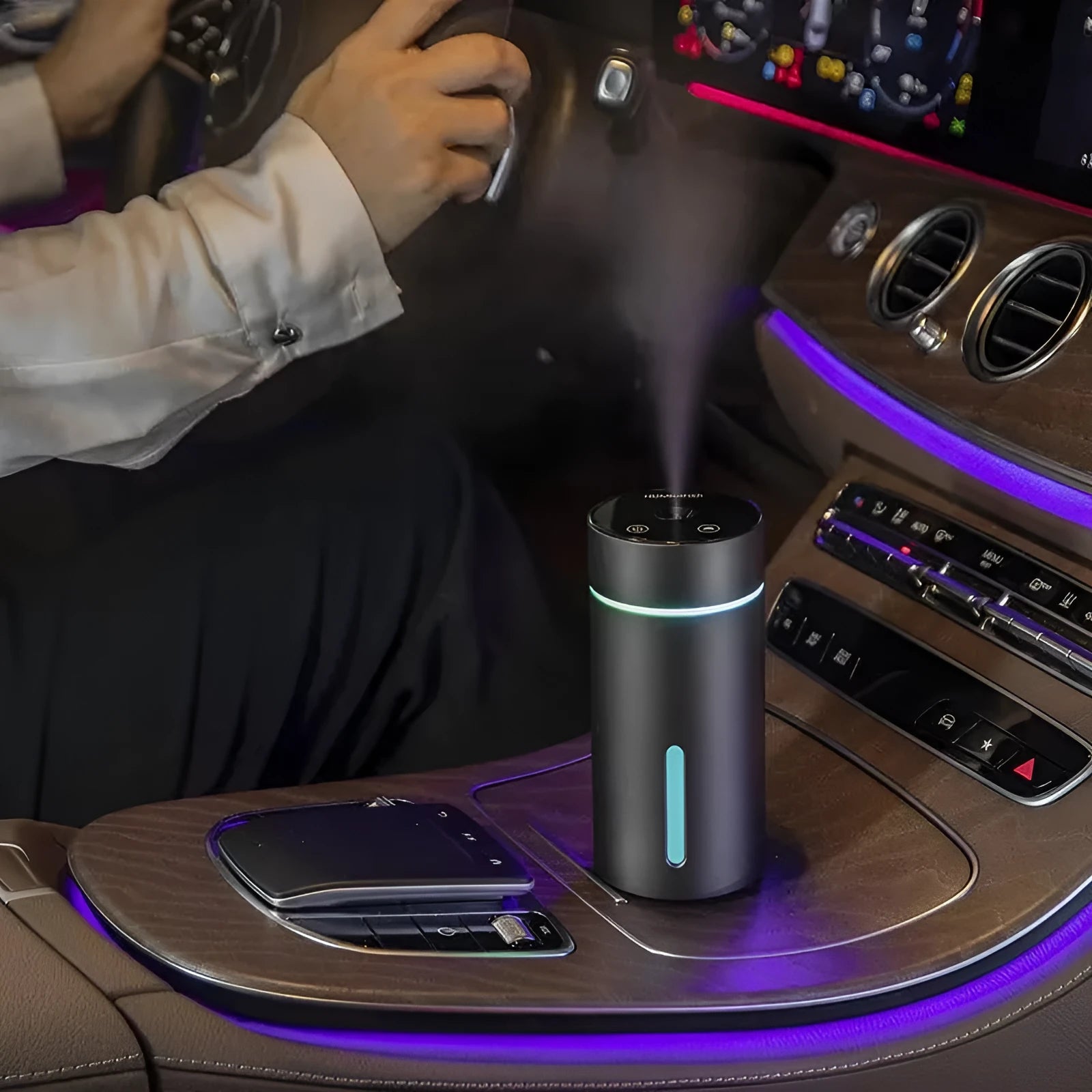 Black aluminium portable car air humidifier and essential oil diffuser unit with USB cable.
