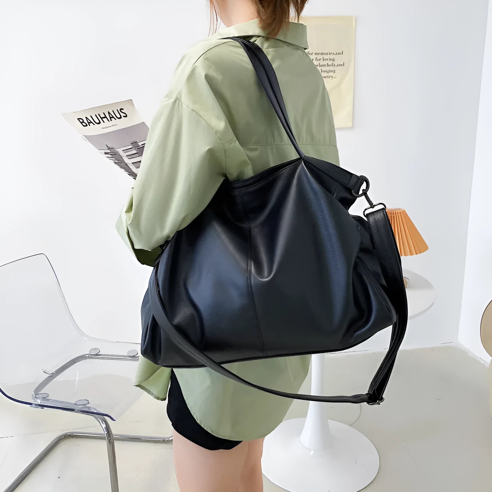 Large soft black PU leather messenger bag with adjustable shoulder strap and front zip.