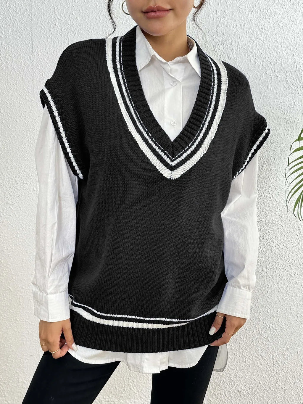 Women's college style wool vest sweater in acrylic-polyester blend available in black, blue, coffee colours