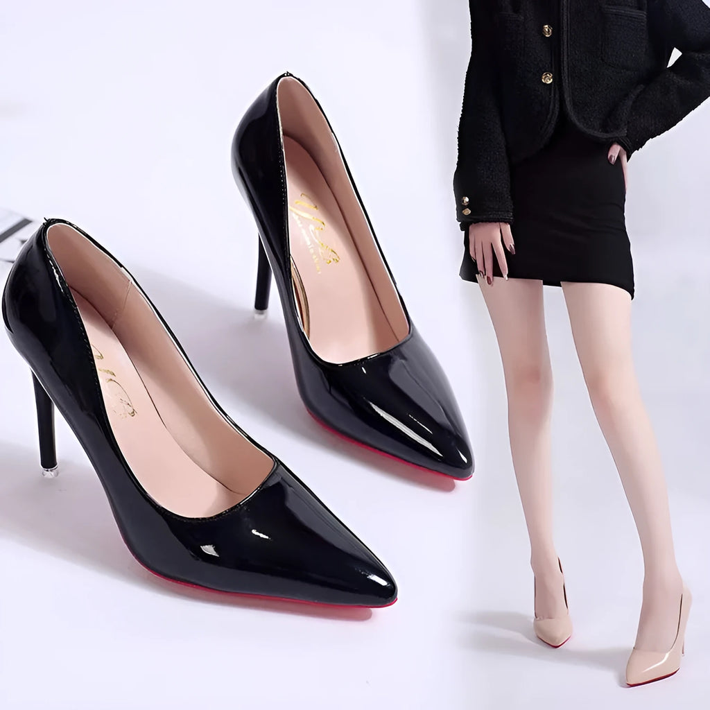 Women's black stiletto heel pump with pointed toe and shallow mouth design on a white background.