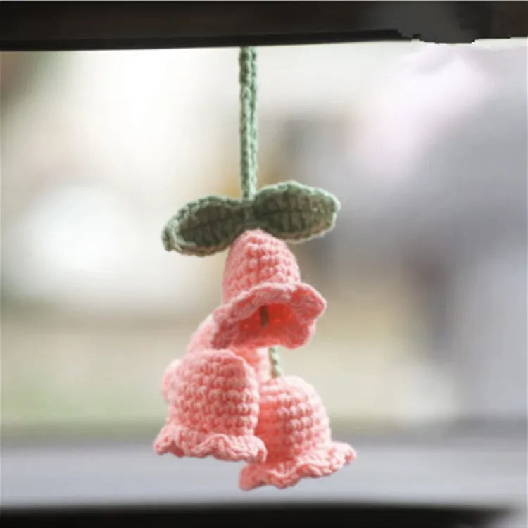 Knitted green and white car plant decoration with hanging rope
