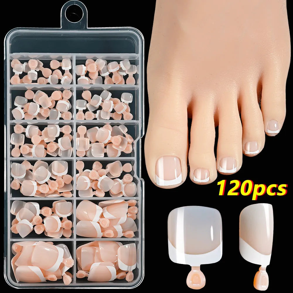 Open box showing 120 French style toe nail pieces with white tips in various nude colours.