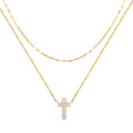 Sterling silver geometric cross pendant necklace with double layer design and diamond detailing on clavicle chain