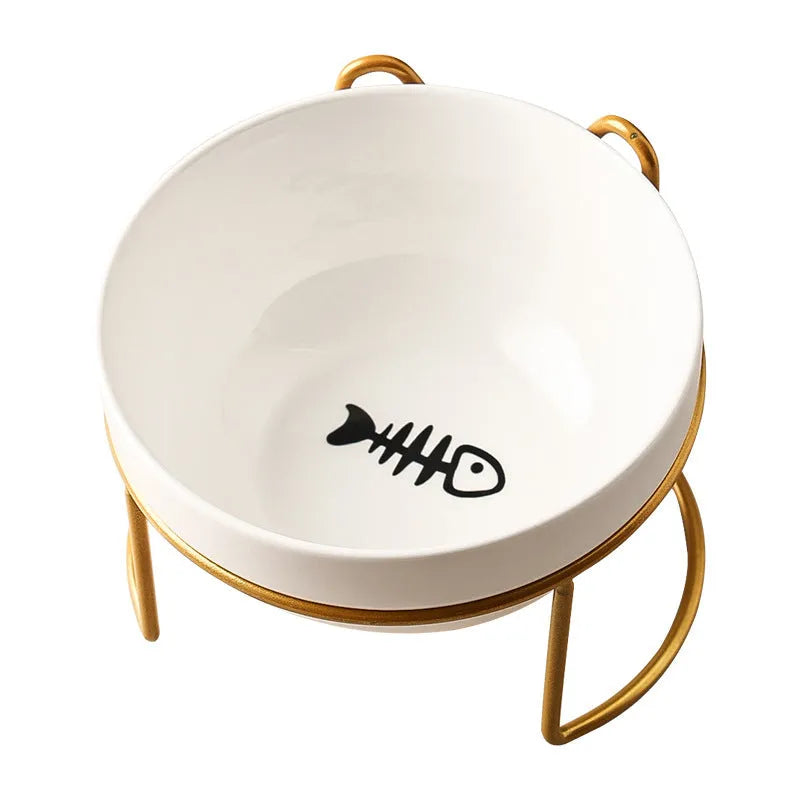 White ceramic cat food bowl with cat paw print design on black iron frame stand