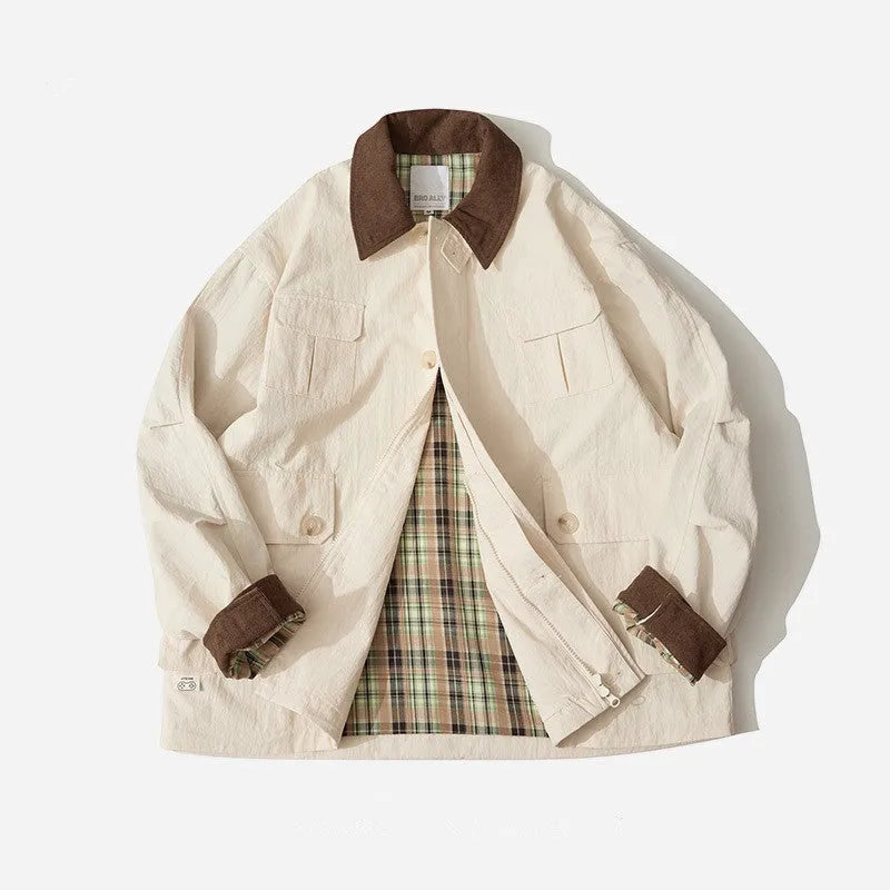 Green and apricot unisex casual jacket with contrast colour blocks and side seam pockets.