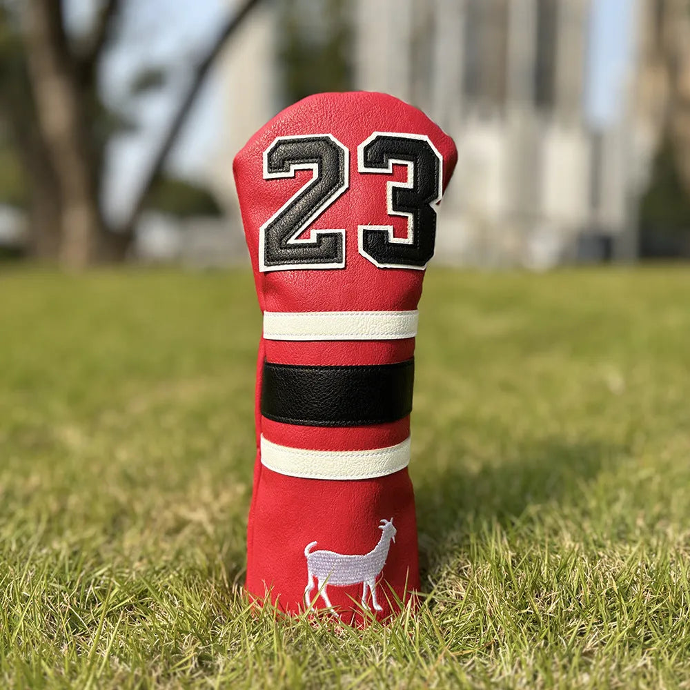 Red square putter iron head golf club sleeve covering a wooden pole set