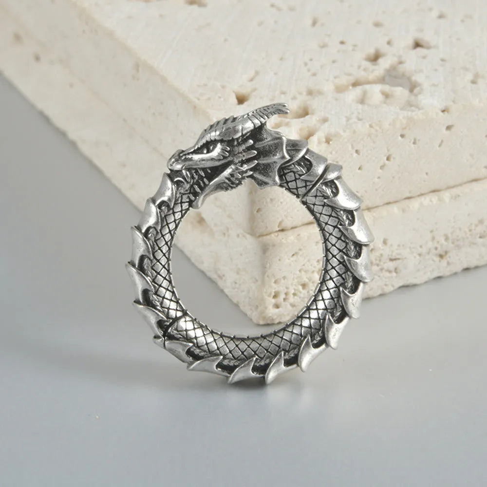 Geometric hollow-out stainless steel earrings with large copper auricle shape in antique silver dragon finish.