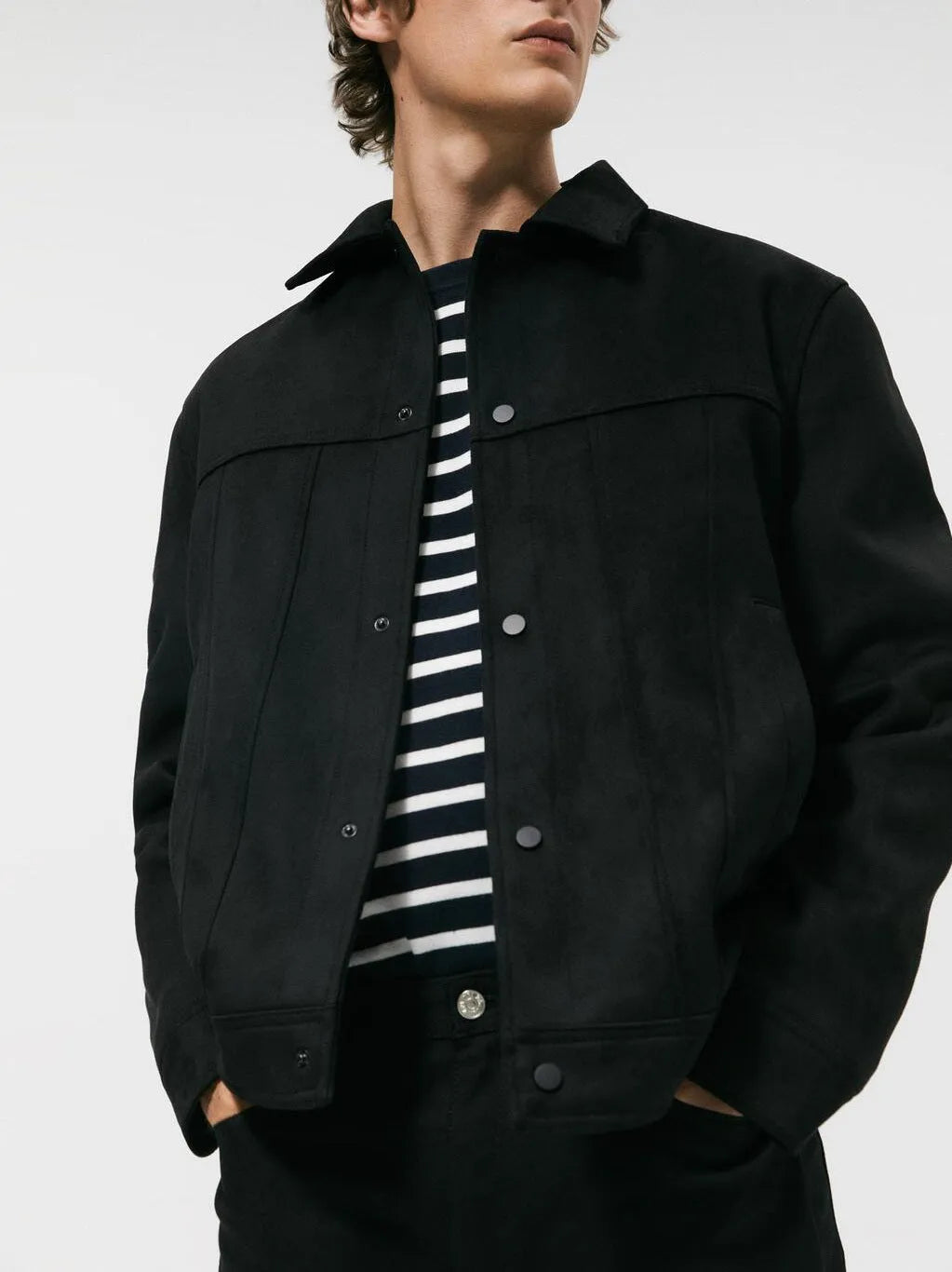 Black men's hooded jacket with a suede collar and side pockets, shown on a hanger.
