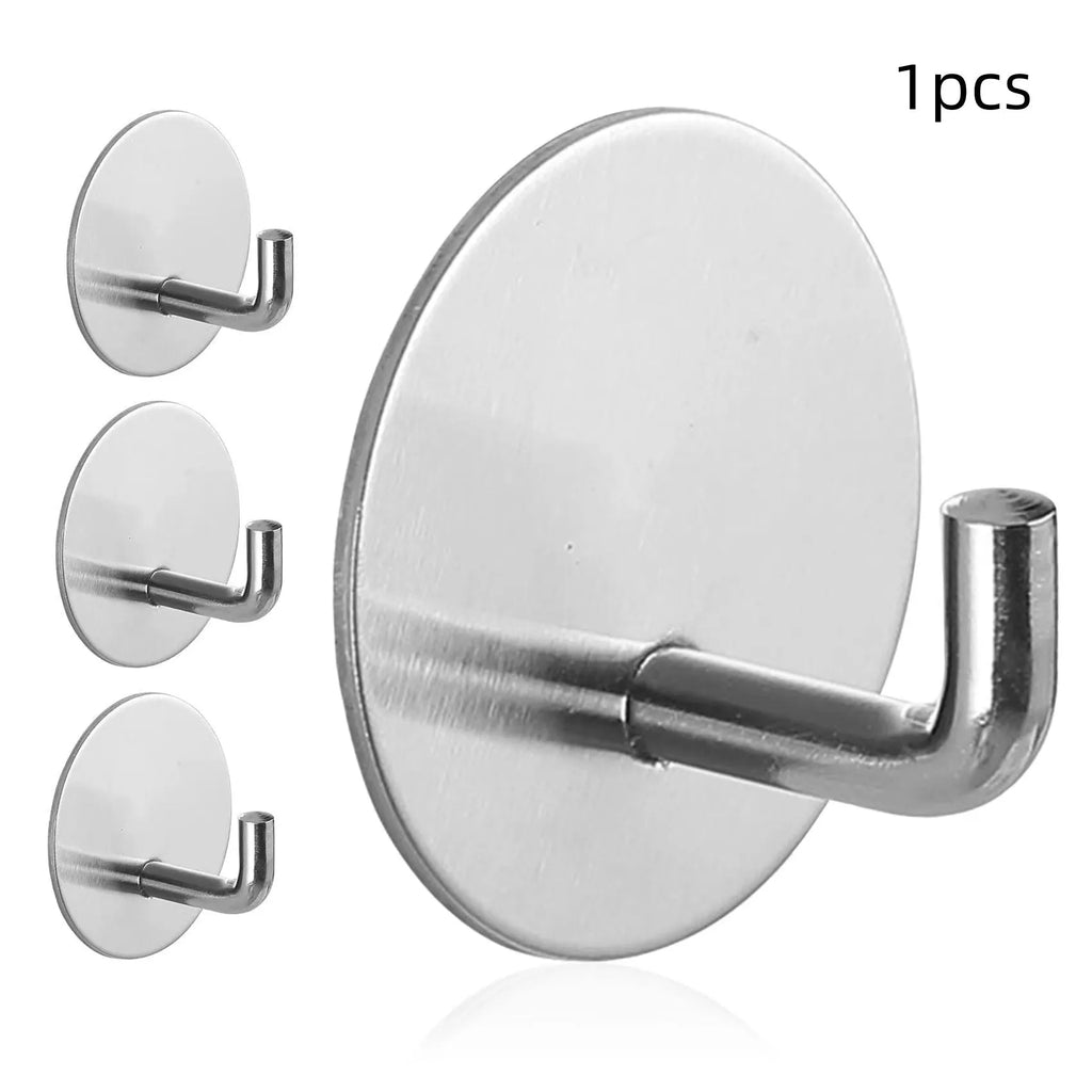 Two stainless steel self-adhesive wall hooks, one black and one polished, on a white background.