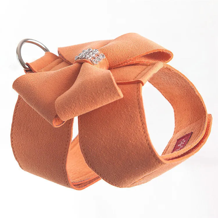 Adjustable puppy chest strap with bowknot design in microfiber material showing pink blue orange colour options