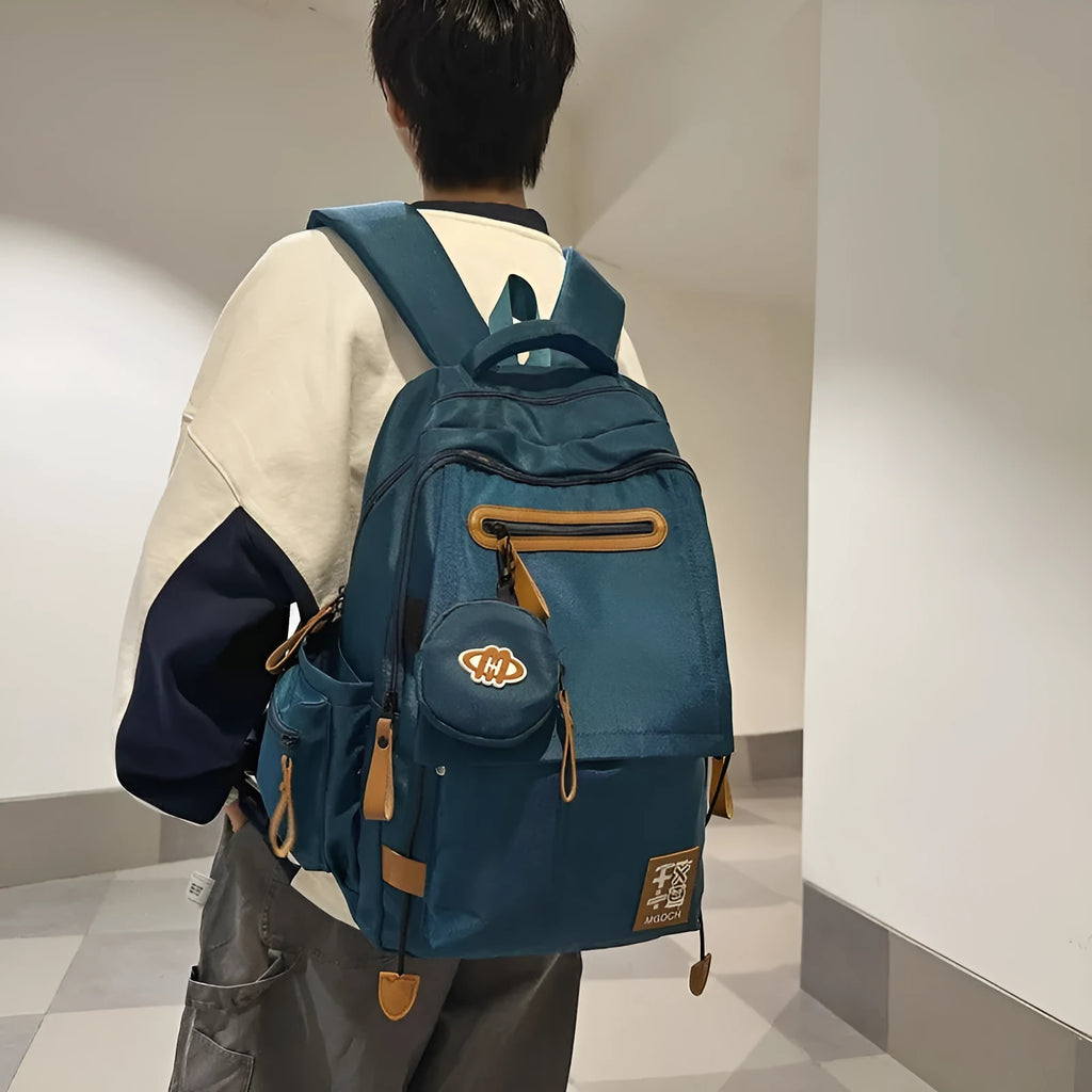 Large black nylon backpack for middle school students with curved shoulder straps.