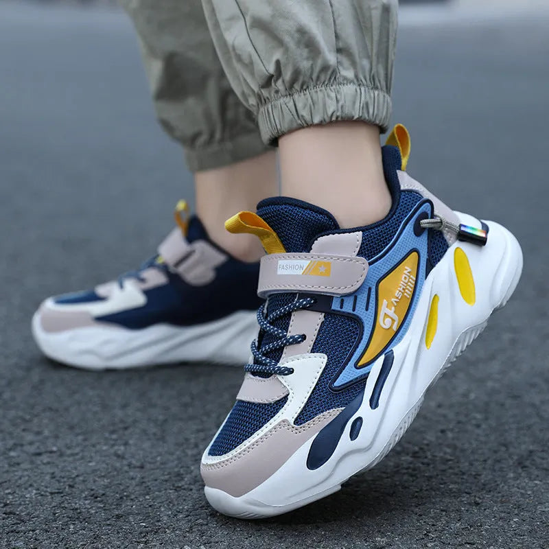 Boys' blue and black Velcro fastening sports shoes with a textured non-slip sole.