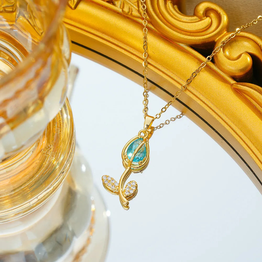 Zircon tulip necklace for women in gold tone with flower pendant on adjustable O-ring chain.