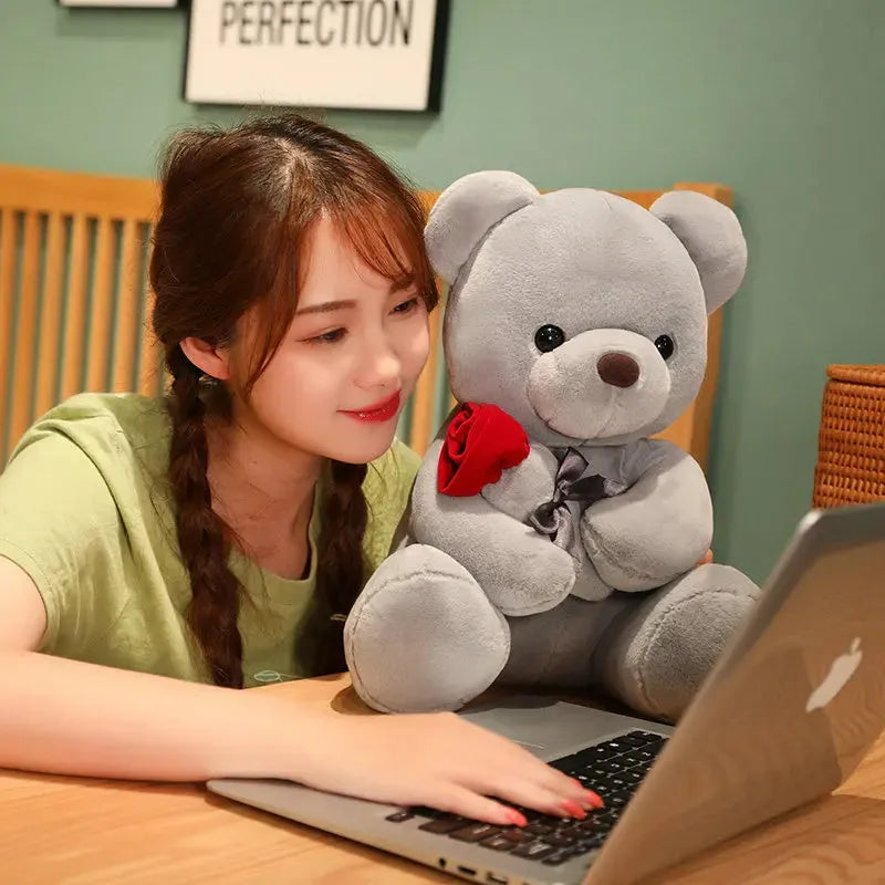 Rose bear plush teddy bear stuffed animal toy in beige, brown or grey colours showing cartoon design