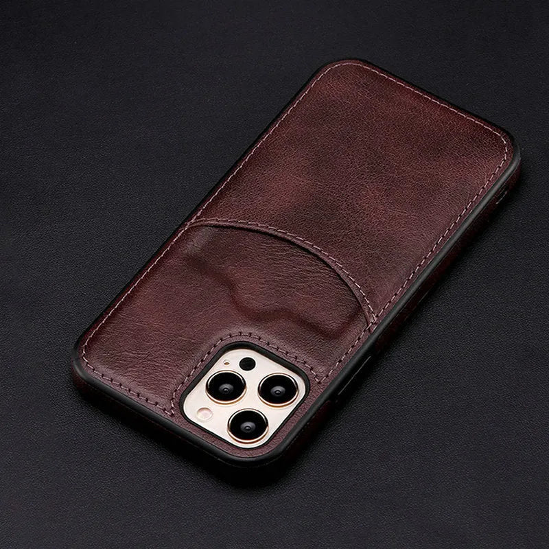 Dark blue PU leather protective case for iPhone models on a table.
