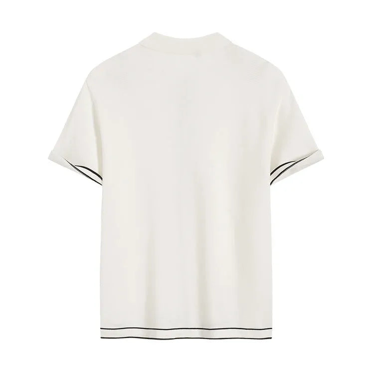White short sleeve cardigan with dark contrast lapels on a hanger