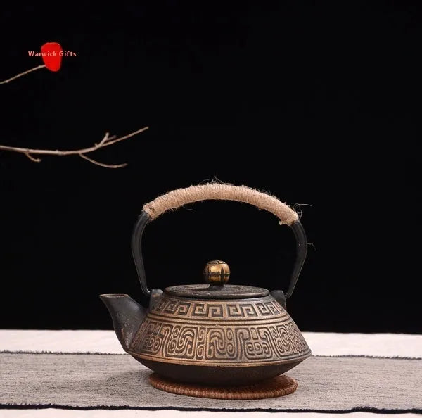 Japanese-style cast iron teapot with decorative enamel finish and 0.9-litre capacity