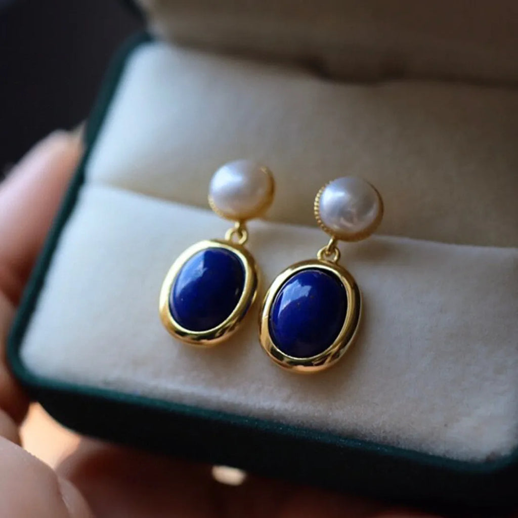 Silver earrings with blue lapis lazuli pearls and auspicious pattern details