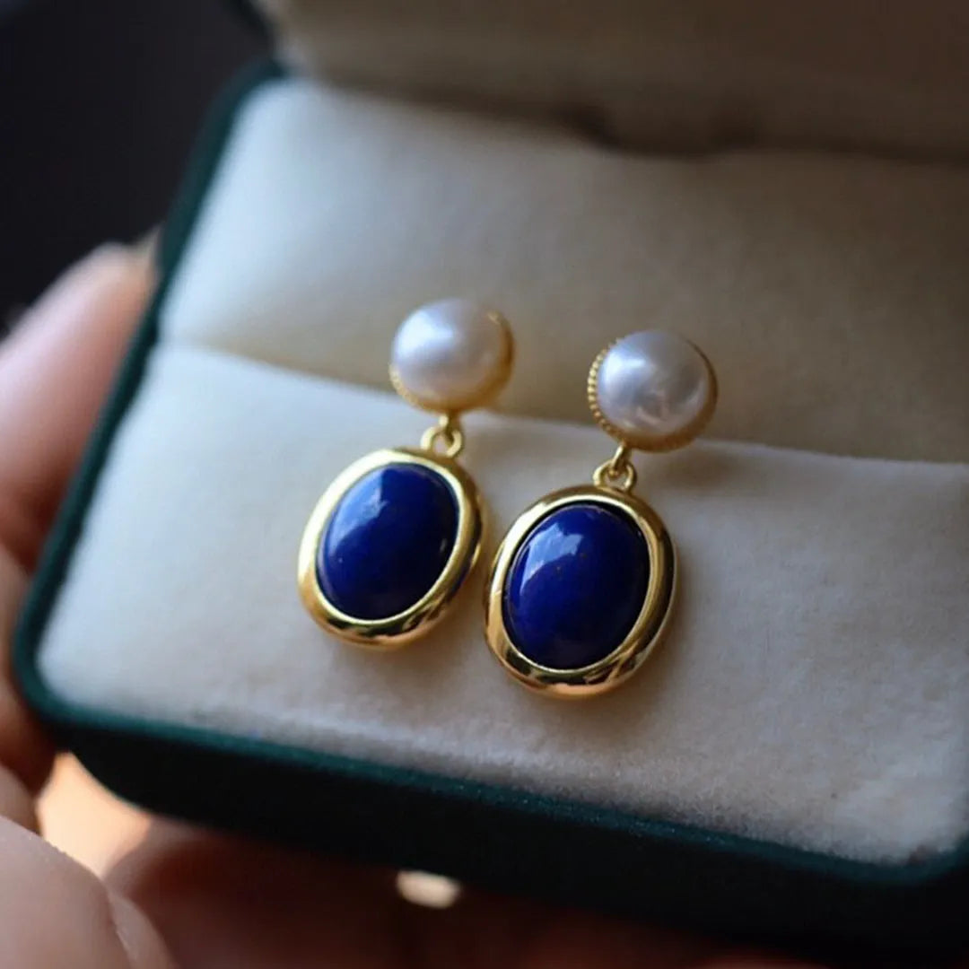 Silver earrings with blue lapis lazuli pearls and auspicious pattern details