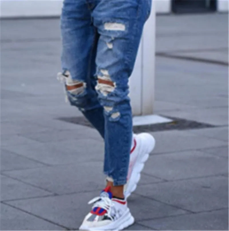 Men's deep blue ripped jeans with distressed hole detailing in 100% cotton fabric