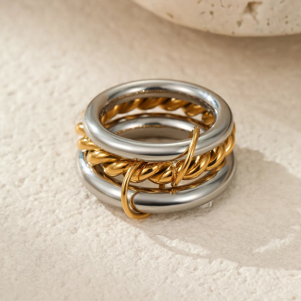 Stacked colour matching stainless steel rings with 18K gold plating in three colour variants for women