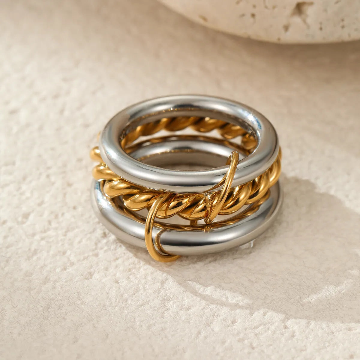Stacked colour matching stainless steel rings with 18K gold plating in three colour variants for women