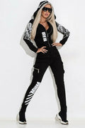 Black women's hooded casual suit with wings printing pattern, showing zipper top and matching trousers