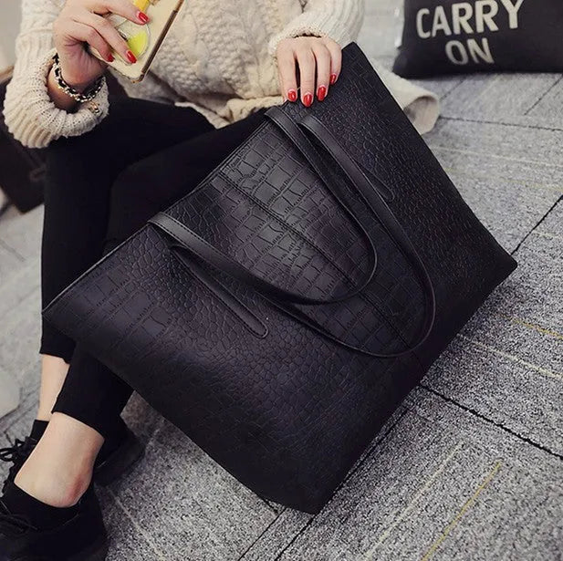 European simple fashion shoulder handbag for women in black and grey colours.