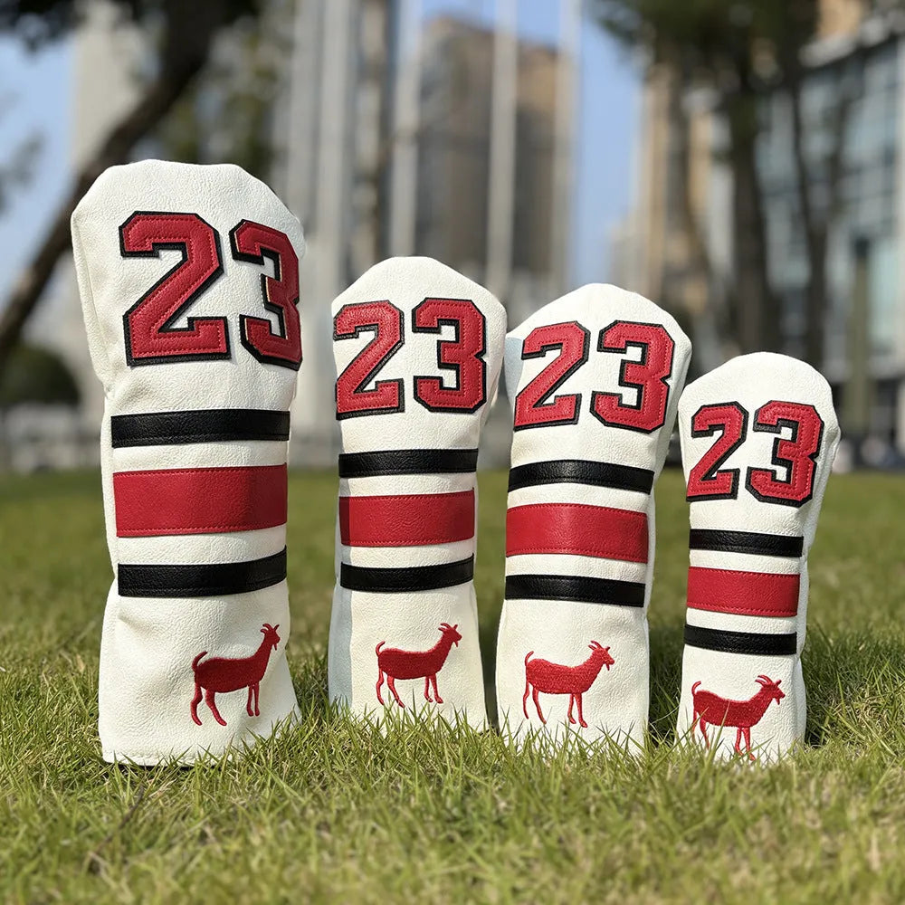 Red square putter iron head golf club sleeve covering a wooden pole set