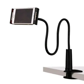 Black bedside oversize flat panel phone holder with a long arm mounted on a table.