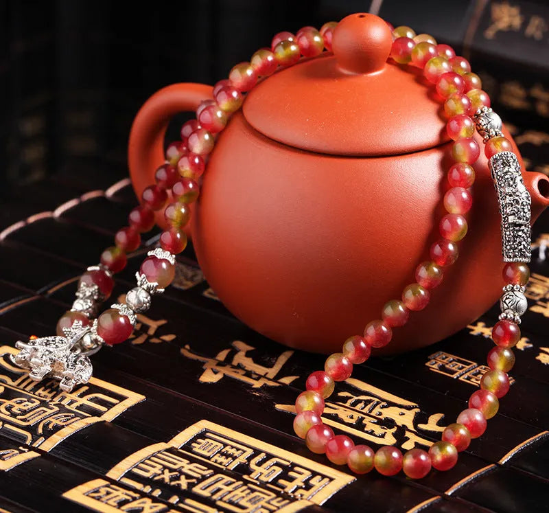 Natural watermelon crystal bracelet with Chinese knot and geometric beads in elephant style