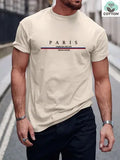 Man wearing a heavy grey pure cotton T-shirt with a printed letter design and short sleeves.