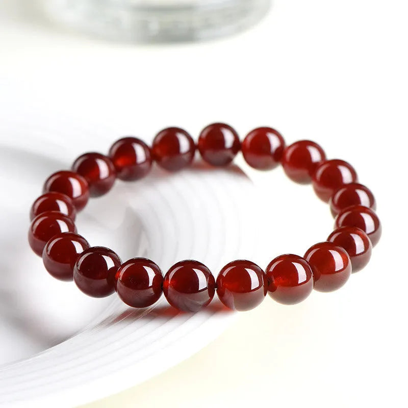 Natural Orange Red Garnet ball crystal bracelet with retro styling and Ruyi element in unisex design
