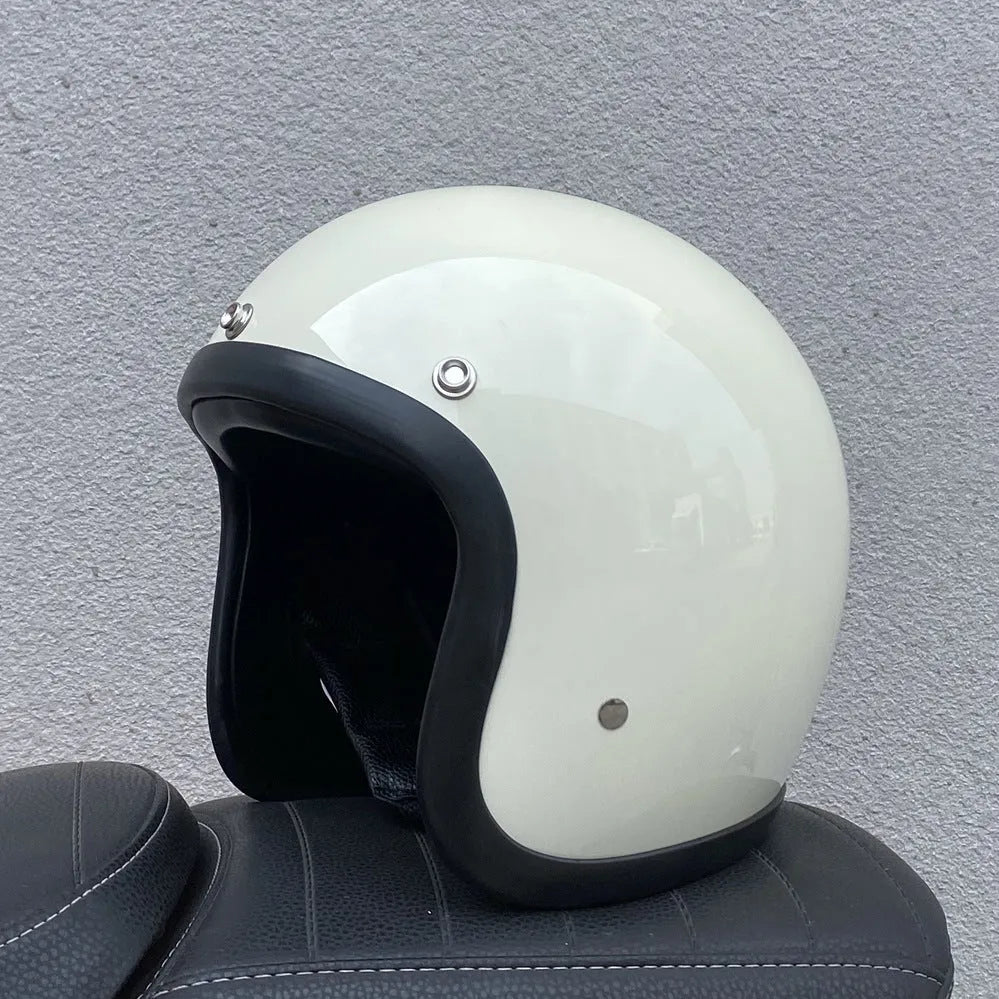Glass fibre motorcycle half helmet shown in a retro style on a stand.